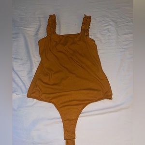 80% Polyester, 14% rayon, 6% spandex, hand wash cold, DO NOT bleach